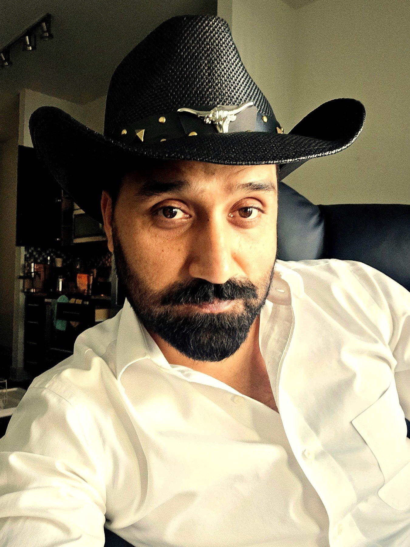 Ish in a white shirt and cowboy hat in Austin, Texas